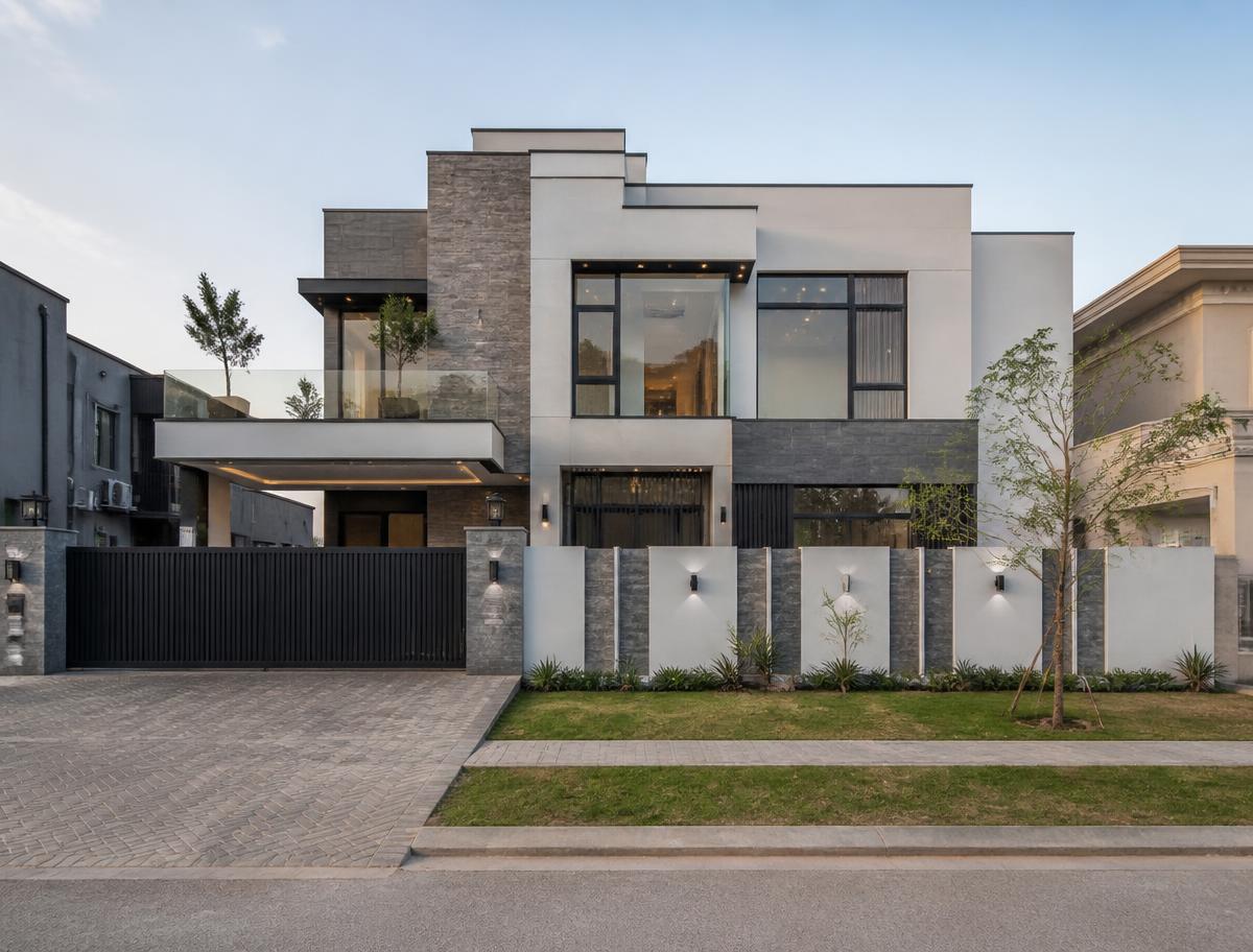 Newly completed modern house with grey stone and white plaster facade in an upscale Lahore residential society